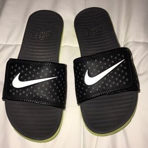 Size 8 black and lime green Nike slides